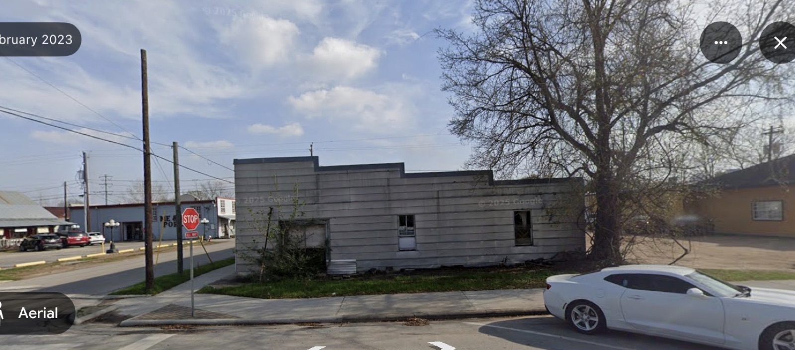 The gray building on the corner before it was demolished